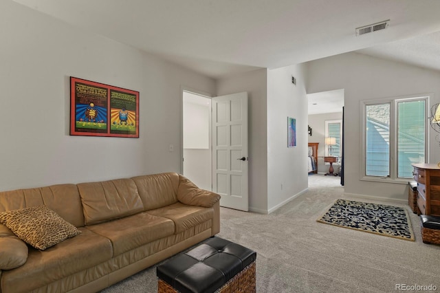 living room with light carpet, baseboards, visible vents, and vaulted ceiling