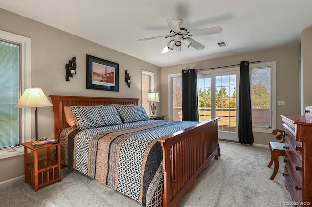 bedroom featuring carpet flooring, visible vents, baseboards, a ceiling fan, and access to exterior