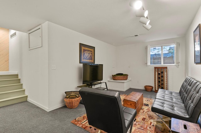 office featuring carpet flooring, visible vents, and baseboards