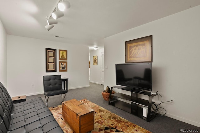 living room featuring baseboards, visible vents, and dark colored carpet