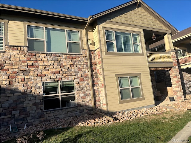 view of side of property featuring a balcony