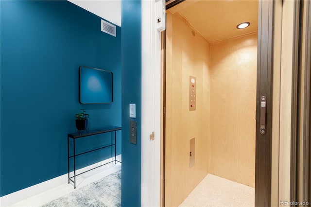 hall featuring elevator and recessed lighting