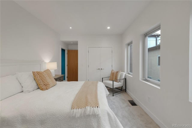 bedroom with visible vents, baseboards, carpet, recessed lighting, and a closet