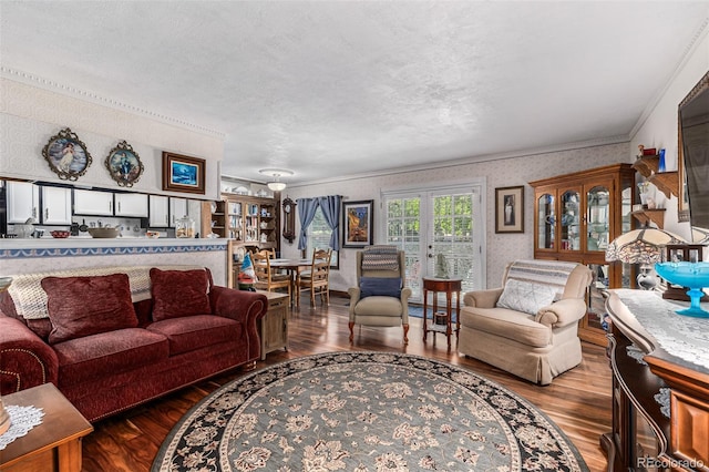 living room featuring hardwood / wood-style flooring, crown molding, and a textured ceiling