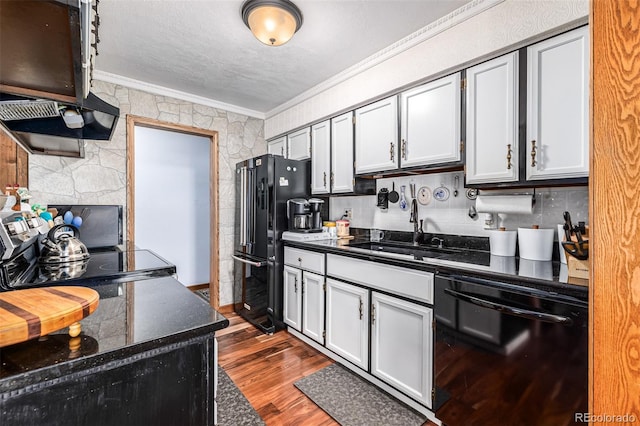 kitchen featuring black appliances, sink, ornamental molding, range hood, and dark hardwood / wood-style flooring