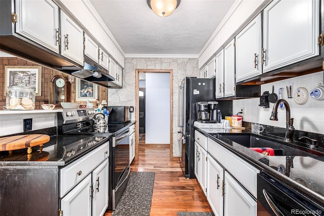 kitchen with white cabinets, sink, dishwasher, light hardwood / wood-style floors, and stainless steel electric range oven