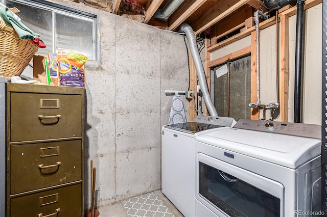 laundry area with independent washer and dryer