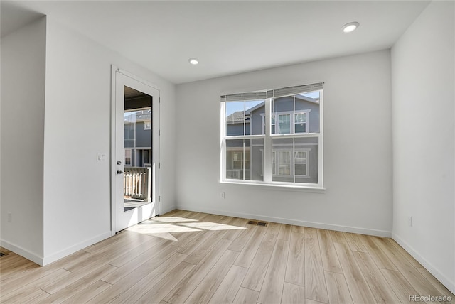 interior space with recessed lighting, visible vents, baseboards, and wood finished floors