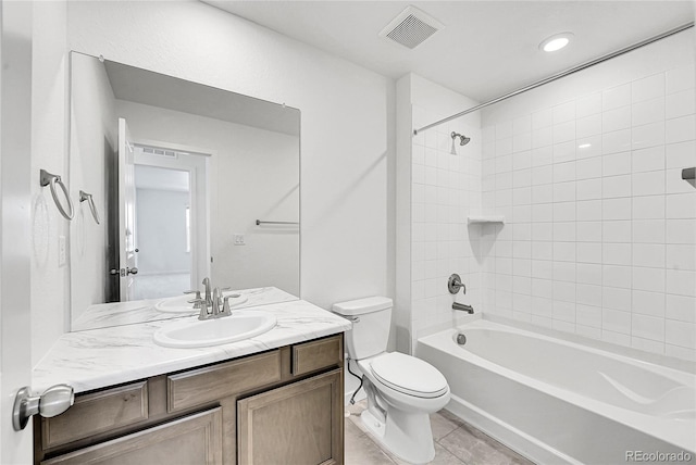 bathroom with shower / bathtub combination, visible vents, toilet, vanity, and tile patterned flooring