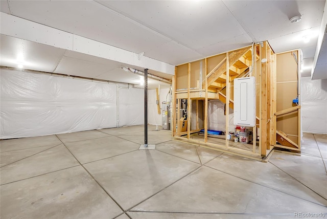 unfinished basement with electric water heater