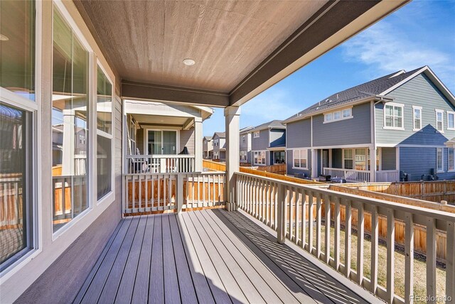 wooden terrace featuring a residential view