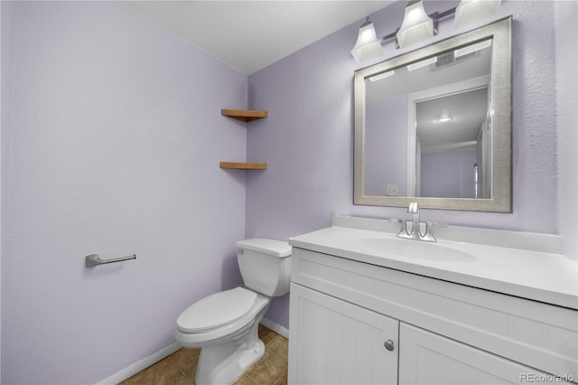 19398 E Eastman Pl, Aurora, CO 80013 - bathroom with toilet, baseboards, vanity, a textured wall, and tile patterned floors