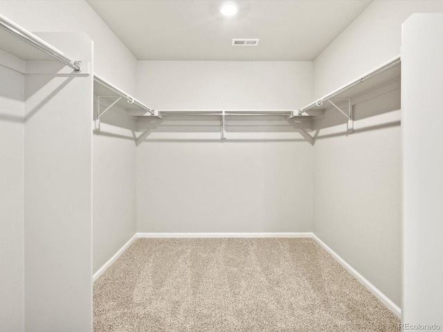 walk in closet with carpet flooring and visible vents