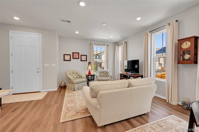 living room with light hardwood / wood-style floors