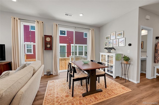 dining room with light hardwood / wood-style floors