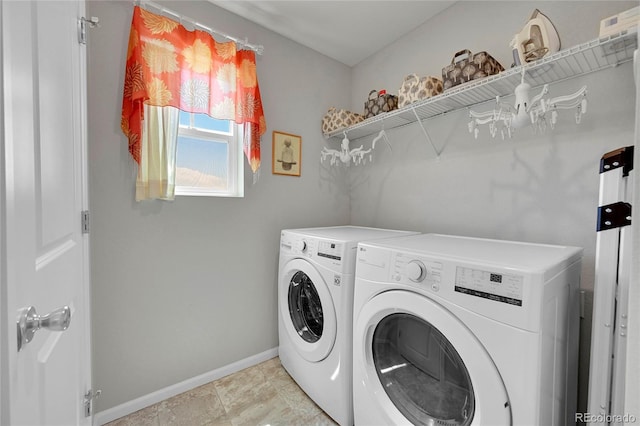 clothes washing area featuring washer and clothes dryer