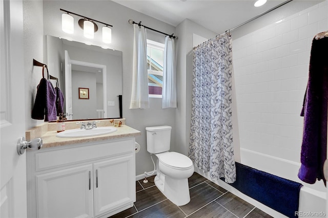 full bathroom with shower / tub combo with curtain, vanity, and toilet