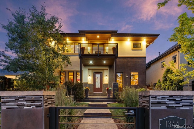 1344 S Saint Paul St, Denver, CO 80210 - contemporary home featuring a balcony, a fenced front yard, and a gate