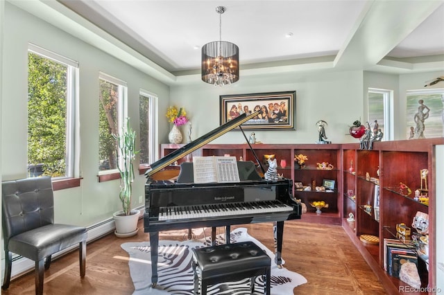 1344 S Saint Paul St, Denver, CO 80210 - living area featuring a raised ceiling, a chandelier, wood finished floors, and baseboard heating