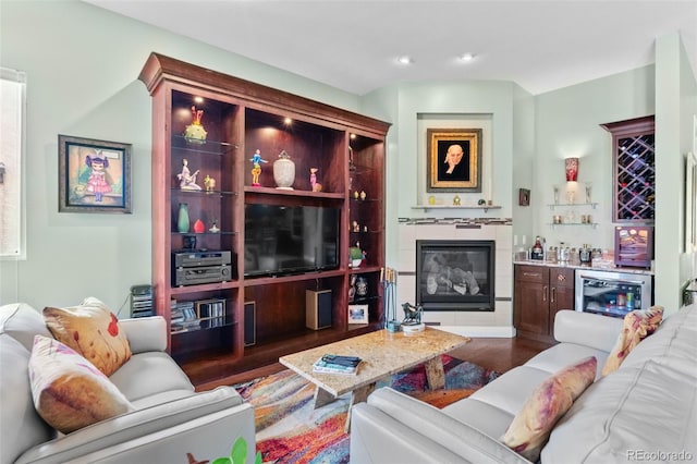 1344 S Saint Paul St, Denver, CO 80210 - living area featuring a dry bar, wood finished floors, a tile fireplace, recessed lighting, and wine cooler