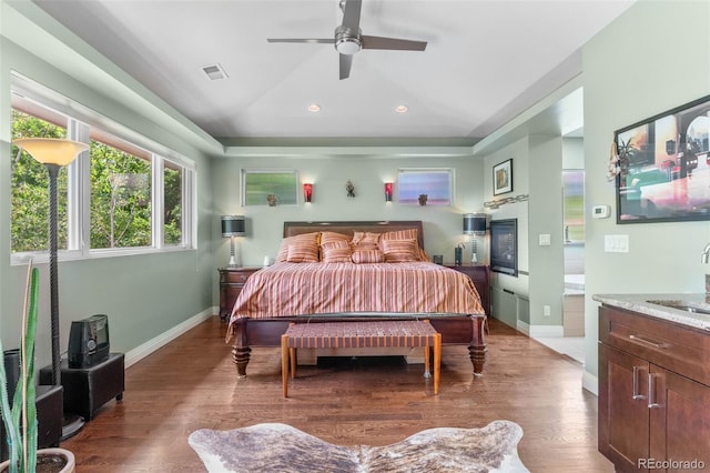 1344 S Saint Paul St, Denver, CO 80210 - bedroom featuring recessed lighting, wood finished floors, a ceiling fan, and a raised ceiling