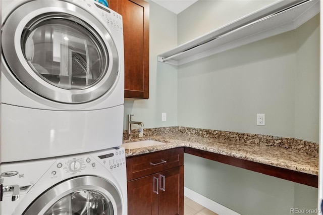 1344 S Saint Paul St, Denver, CO 80210 - laundry room with stacked washer and clothes dryer and cabinet space