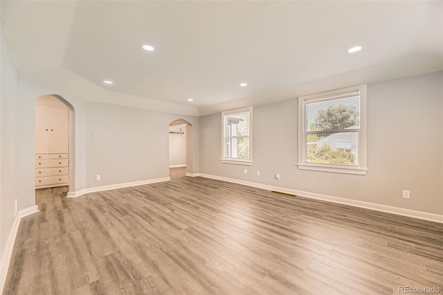 1187 Syracuse St, Denver, CO 80220 - unfurnished room featuring arched walkways, light wood-type flooring, and recessed lighting