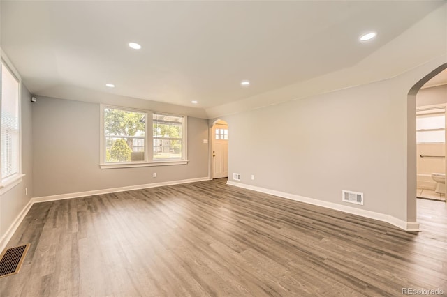 1187 Syracuse St, Denver, CO 80220 - unfurnished room with arched walkways, wood finished floors, and recessed lighting