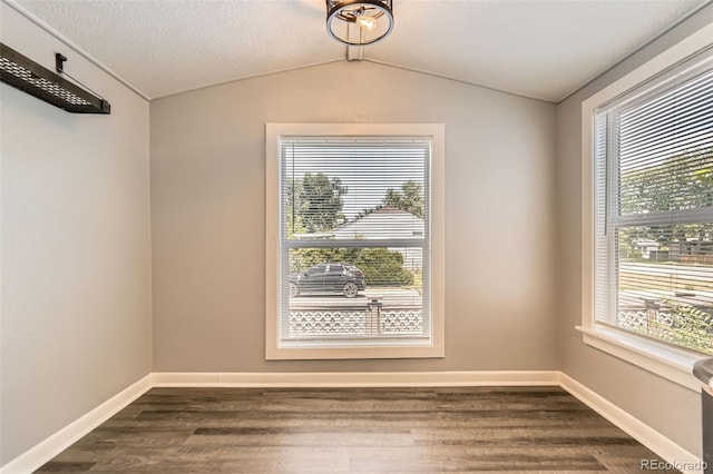 1187 Syracuse St, Denver, CO 80220 - spare room featuring dark wood finished floors and lofted ceiling