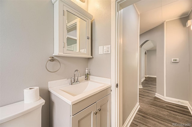 1187 Syracuse St, Denver, CO 80220 - half bathroom with wood finished floors and vanity