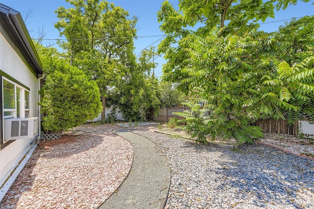 1187 Syracuse St, Denver, CO 80220 - fenced backyard with cooling unit and a patio