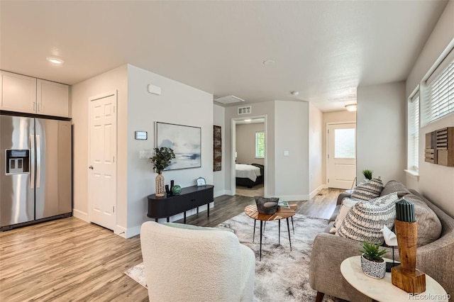 65 Avocet Ct, Longmont, CO 80501 - living area with light wood finished floors and baseboards
