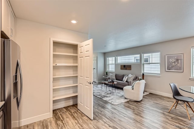 65 Avocet Ct, Longmont, CO 80501 - living area featuring light wood-type flooring, baseboards, and recessed lighting