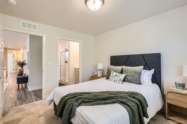 65 Avocet Ct, Longmont, CO 80501 - bedroom with baseboards, connected bathroom, and wood finished floors
