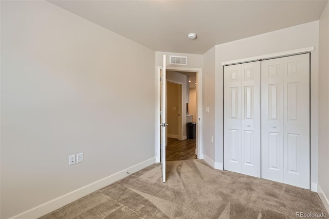 65 Avocet Ct, Longmont, CO 80501 - unfurnished bedroom featuring light carpet, baseboards, and a closet