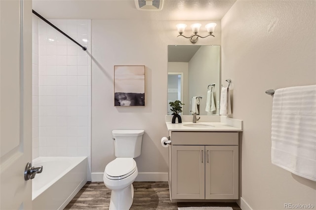 65 Avocet Ct, Longmont, CO 80501 - full bath featuring vanity, wood finished floors, toilet, baseboards, and tub / shower combination