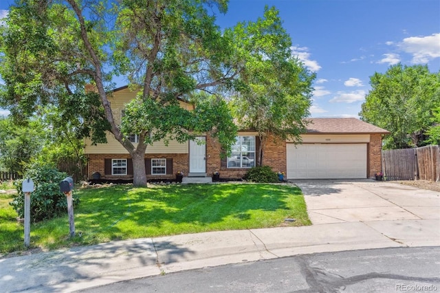 5372 E 108th Pl, Thornton, CO 80233 - tri-level home with brick siding, an attached garage, and concrete driveway
