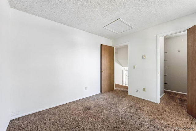 5372 E 108th Pl, Thornton, CO 80233 - unfurnished bedroom with attic access, carpet flooring, and a textured ceiling