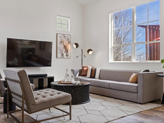 living room with plenty of natural light and light wood-style floors