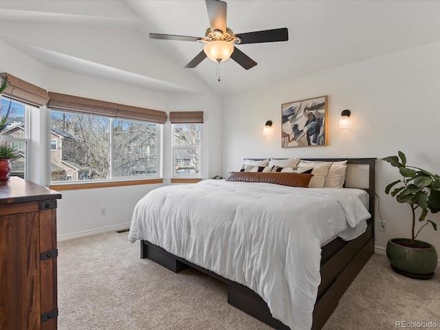 bedroom with visible vents, carpet floors, baseboards, ceiling fan, and vaulted ceiling