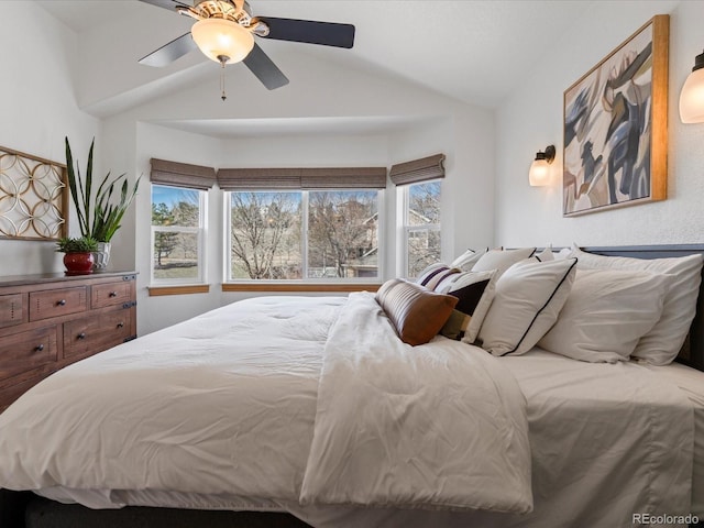 bedroom with multiple windows, lofted ceiling, and ceiling fan