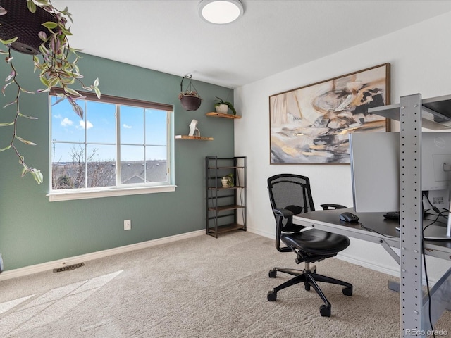 office space with visible vents, baseboards, and carpet floors