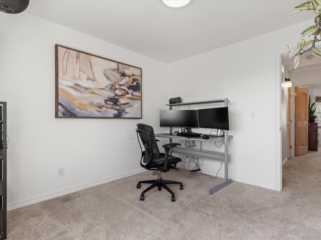 office with baseboards and carpet