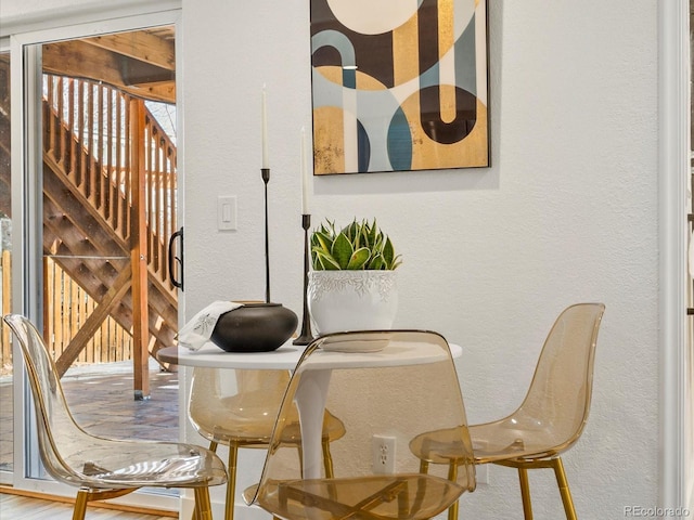 dining space featuring a textured wall