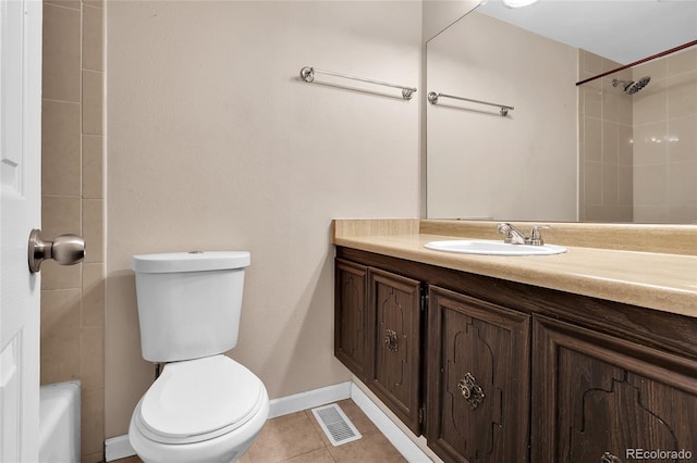 bathroom featuring tile patterned floors, vanity, and toilet