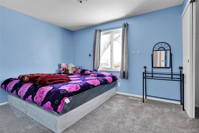 bedroom featuring a closet and carpet floors