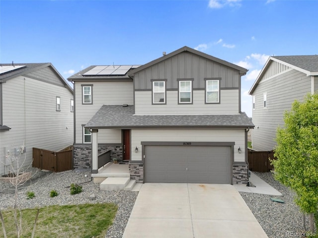 16369 Alberta Dr, Parker, CO 80134 - craftsman-style home featuring board and batten siding, solar panels, fence, a garage, and driveway