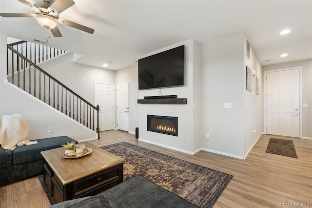 16369 Alberta Dr, Parker, CO 80134 - living area featuring stairs, recessed lighting, wood finished floors, baseboards, and a ceiling fan