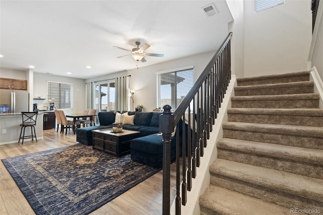 16369 Alberta Dr, Parker, CO 80134 - living room featuring light wood-style flooring, a ceiling fan, stairs, recessed lighting, and baseboards