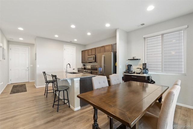 16369 Alberta Dr, Parker, CO 80134 - dining room featuring light wood-style floors, recessed lighting, and baseboards